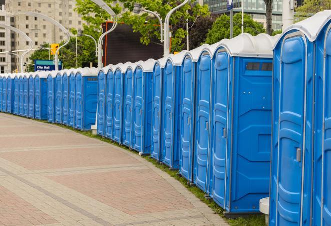 a row of portable restrooms at a fairground, offering visitors a clean and hassle-free experience in wilmer